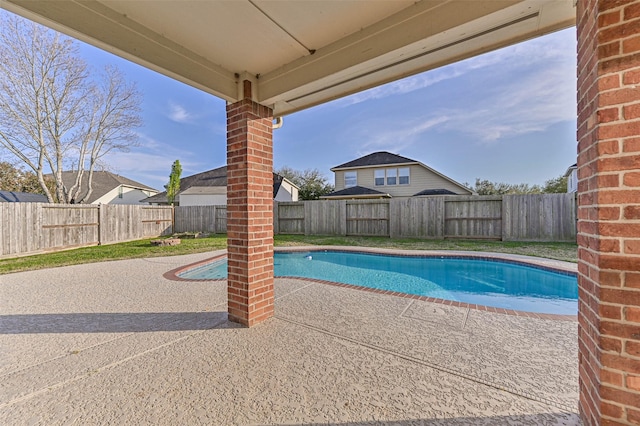 view of swimming pool featuring a fenced backyard, a fenced in pool, and a patio