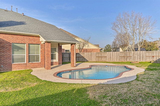 view of swimming pool featuring a patio area, a fenced in pool, a fenced backyard, and a lawn