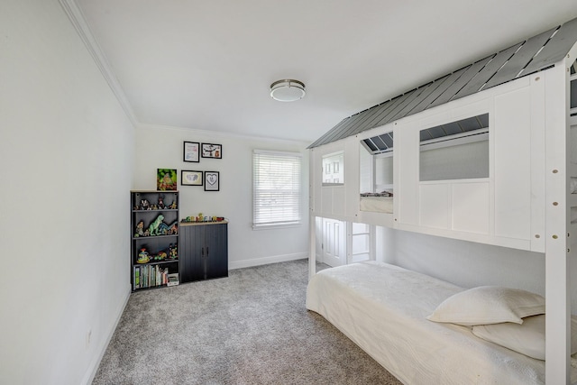 bedroom featuring baseboards, carpet flooring, and crown molding