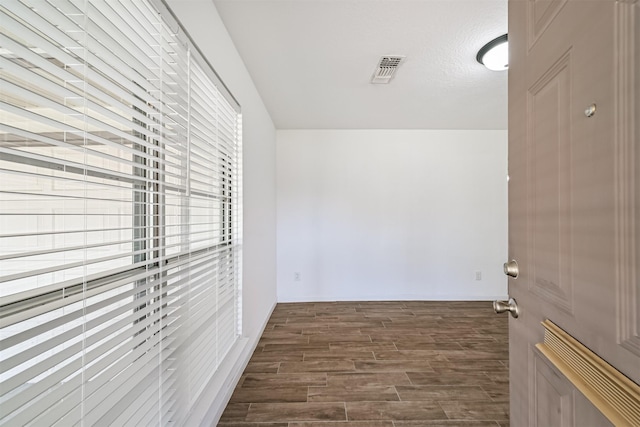 interior space with visible vents and wood finished floors