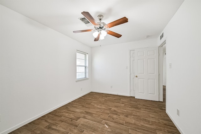 unfurnished bedroom featuring visible vents, baseboards, and wood finished floors