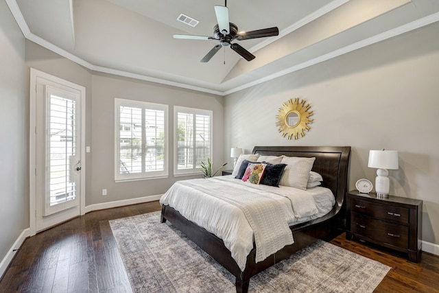 bedroom with visible vents, multiple windows, lofted ceiling, and dark wood-style flooring