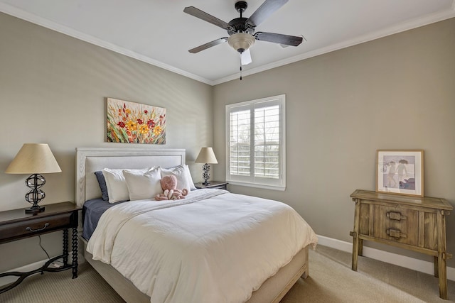 bedroom featuring ceiling fan, baseboards, carpet floors, and ornamental molding