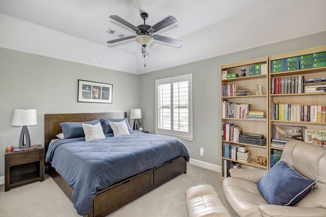 carpeted bedroom featuring a ceiling fan, vaulted ceiling, baseboards, and visible vents