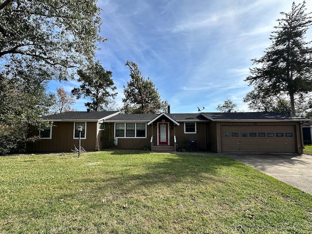 ranch-style home featuring an attached garage, concrete driveway, and a front yard