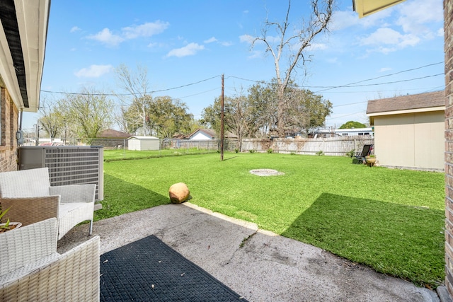 view of yard with cooling unit, a patio, and a fenced backyard