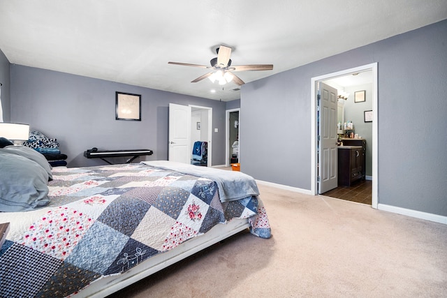 carpeted bedroom featuring connected bathroom, baseboards, and ceiling fan