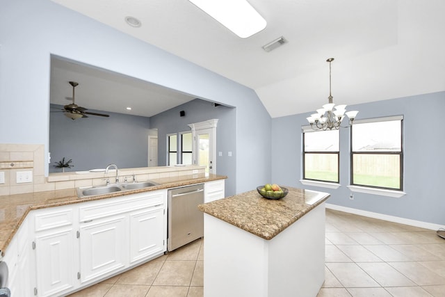 kitchen with visible vents, ceiling fan with notable chandelier, a sink, a kitchen island, and dishwasher