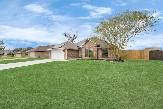 ranch-style home featuring brick siding, a front lawn, fence, concrete driveway, and an attached garage