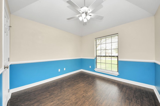 unfurnished room featuring baseboards, lofted ceiling, ceiling fan, and wood finished floors