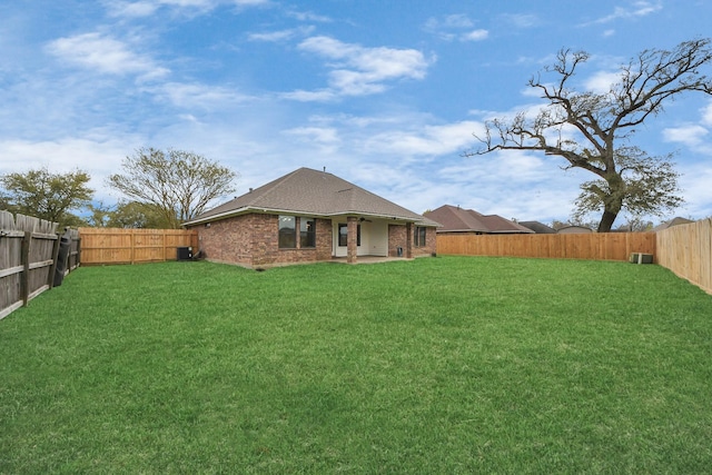 view of yard with a patio and a fenced backyard