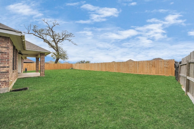 view of yard featuring a patio and a fenced backyard