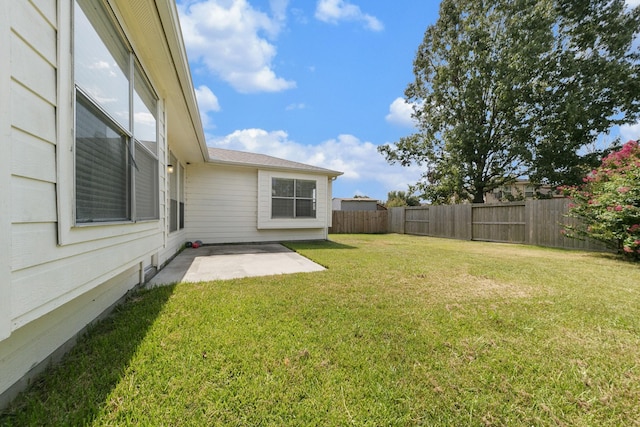 view of yard with a patio and a fenced backyard