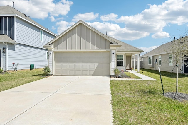 view of front of house with an attached garage, board and batten siding, concrete driveway, and a front yard