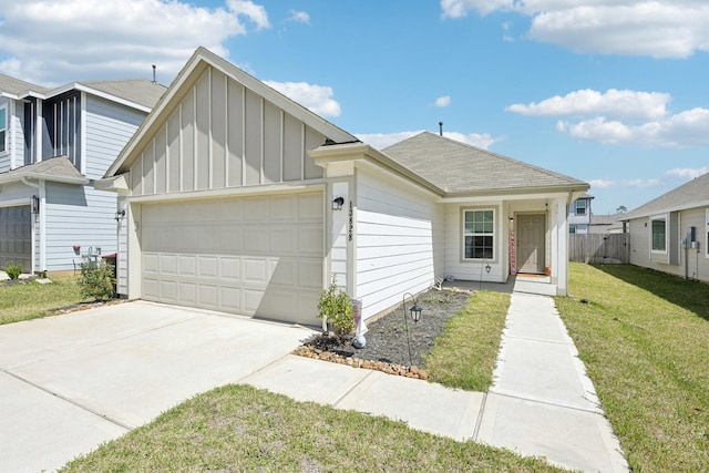 view of front of property with driveway, a front yard, board and batten siding, and an attached garage