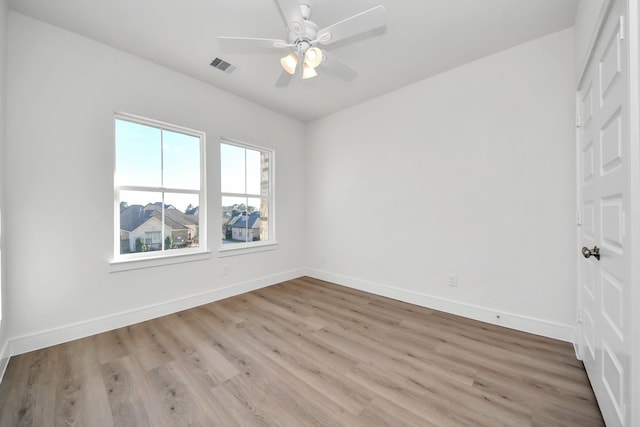 unfurnished room with visible vents, baseboards, and light wood finished floors