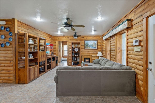 living area with a ceiling fan