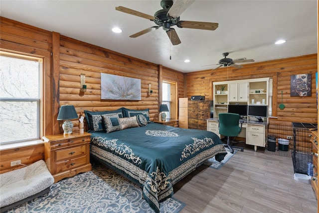 bedroom featuring recessed lighting, multiple windows, and light wood finished floors