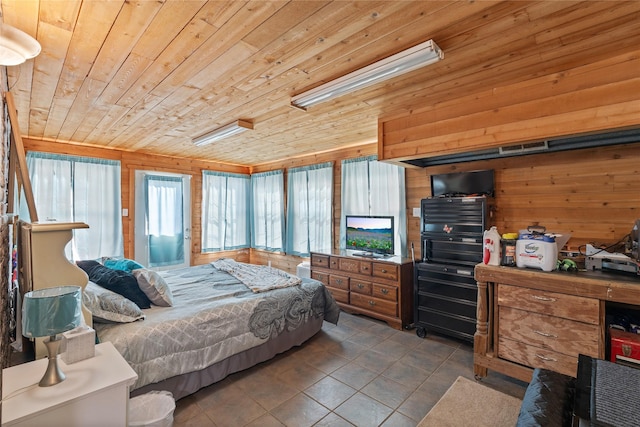 bedroom with tile patterned floors, wooden walls, and wood ceiling