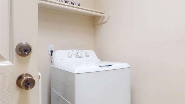 laundry room with laundry area and washer / clothes dryer