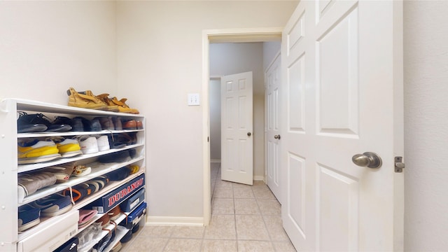 walk in closet featuring light tile patterned floors