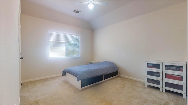 bedroom featuring visible vents, baseboards, carpet, and a ceiling fan