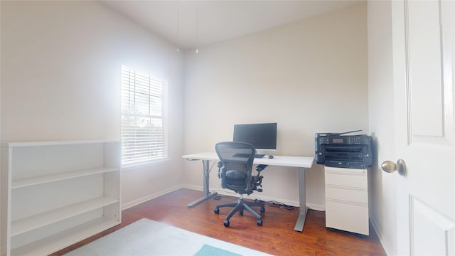 office with baseboards and wood finished floors