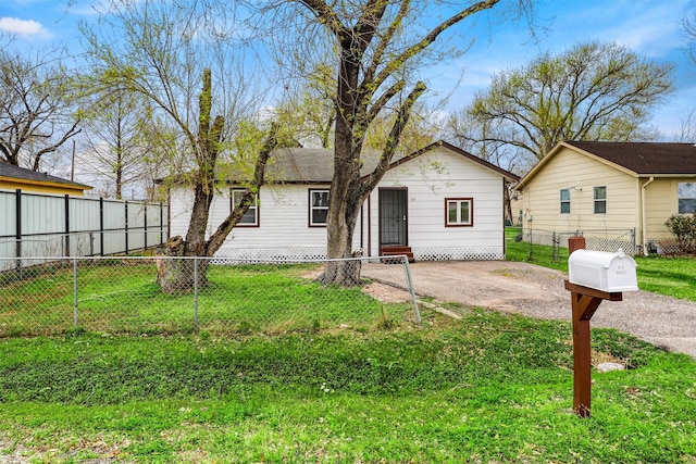 view of front facade with a front lawn, a patio area, and fence private yard