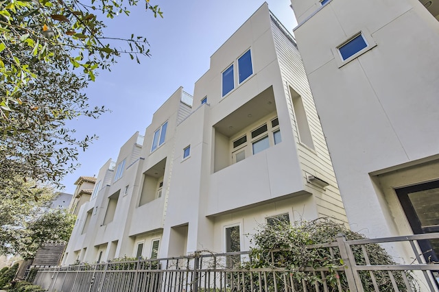 view of property with fence