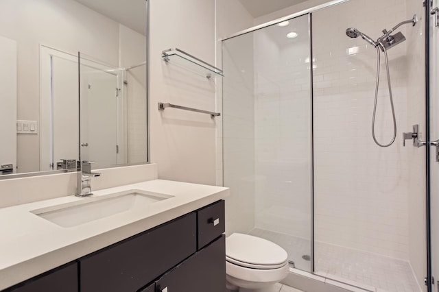 full bath with toilet, a stall shower, and vanity