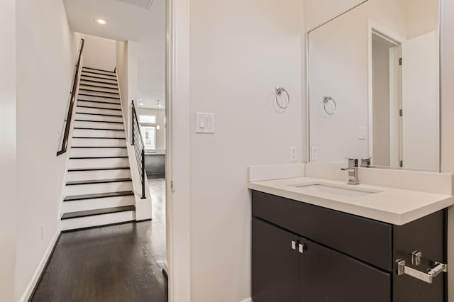 126 Pierce St, Houston, TX 77002 - bathroom with recessed lighting, vanity, baseboards, and wood finished floors