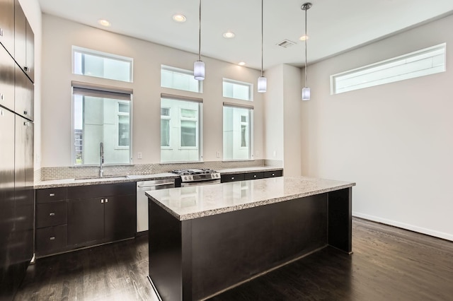 kitchen with a sink, stainless steel appliances, recessed lighting, and dark wood-style flooring