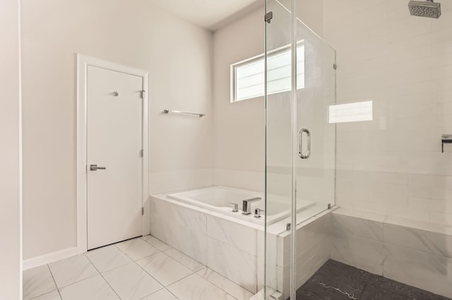 bathroom with a stall shower, tile patterned flooring, and a bath