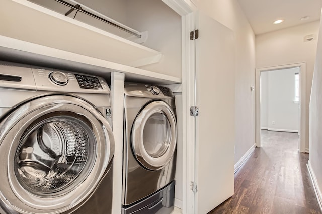 laundry area featuring wood finished floors, baseboards, laundry area, recessed lighting, and washer and clothes dryer