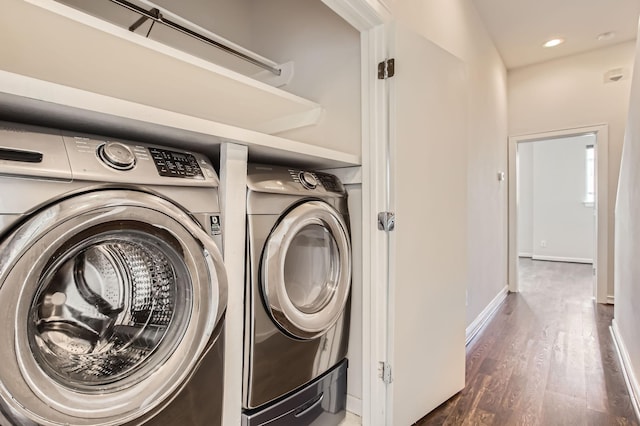 126 Pierce St, Houston, TX 77002 - clothes washing area featuring recessed lighting, baseboards, washer and dryer, laundry area, and wood finished floors