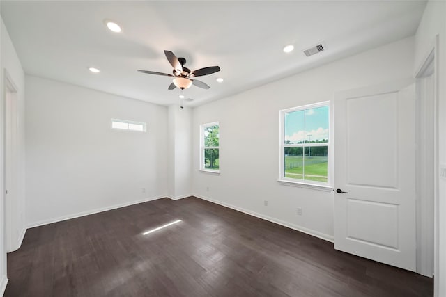 empty room with visible vents, baseboards, recessed lighting, dark wood-style floors, and a ceiling fan