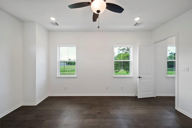 unfurnished room featuring visible vents, baseboards, and a ceiling fan