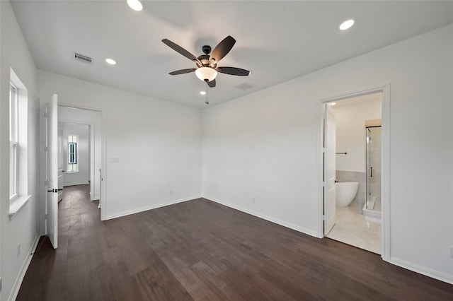 unfurnished bedroom featuring recessed lighting, dark wood-style floors, and visible vents