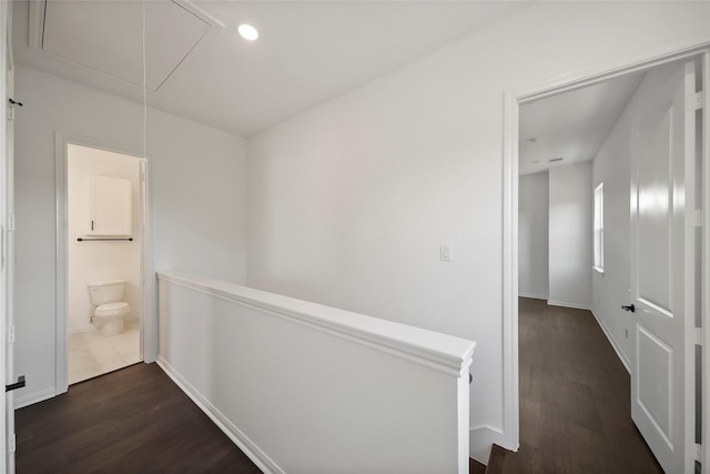 hall featuring recessed lighting, an upstairs landing, attic access, and dark wood finished floors