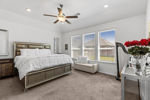 bedroom with visible vents, lofted ceiling, a ceiling fan, carpet floors, and baseboards