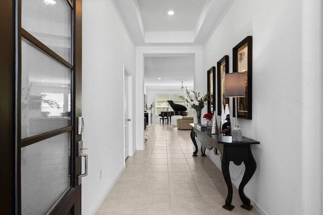 hallway featuring light tile patterned flooring, recessed lighting, and baseboards