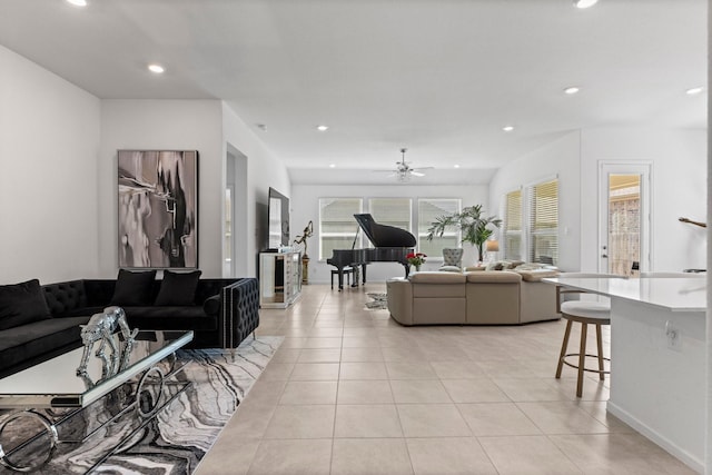 living area featuring light tile patterned floors, plenty of natural light, and recessed lighting