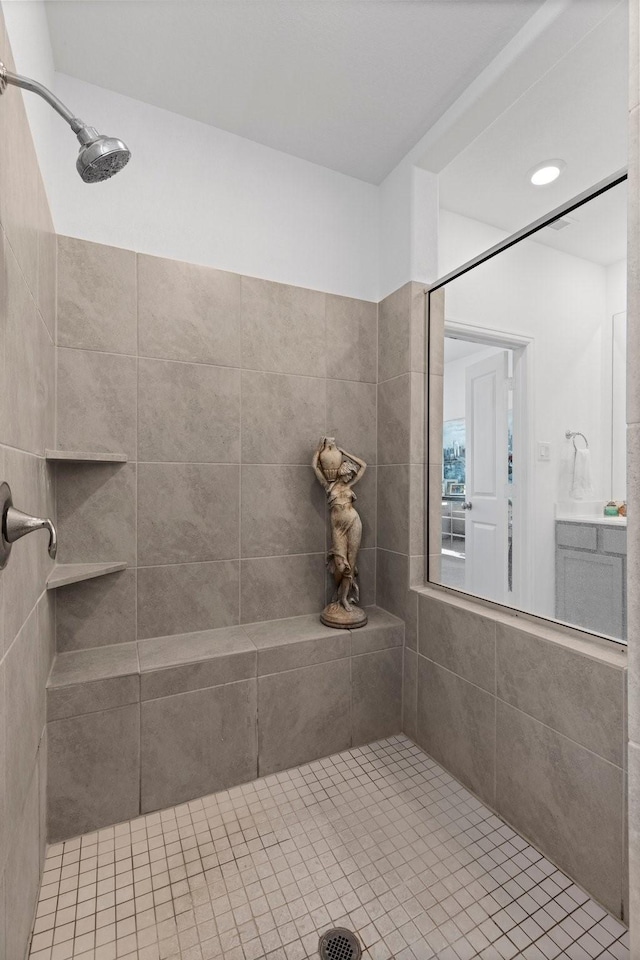 bathroom with tiled shower