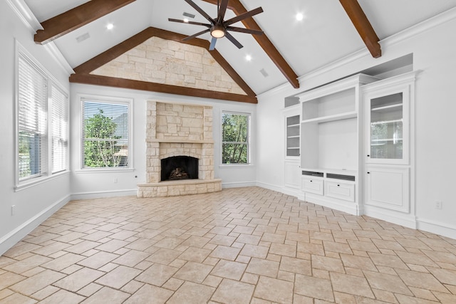 unfurnished living room featuring beam ceiling, built in shelves, a fireplace, and ceiling fan