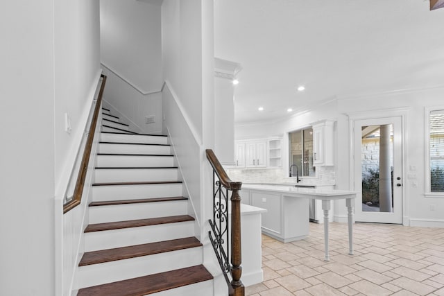 staircase featuring recessed lighting