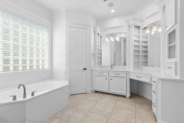 bathroom with vanity, an inviting chandelier, a garden tub, and ornamental molding