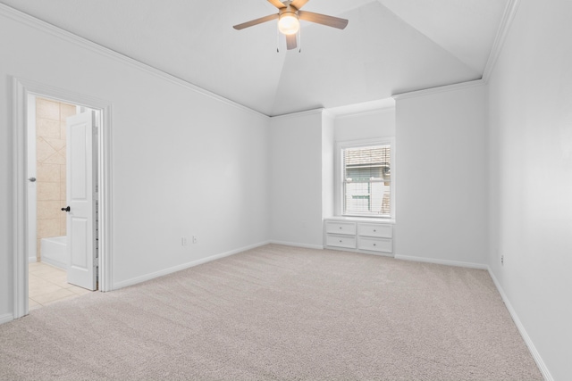 empty room with high vaulted ceiling, ornamental molding, carpet, baseboards, and ceiling fan