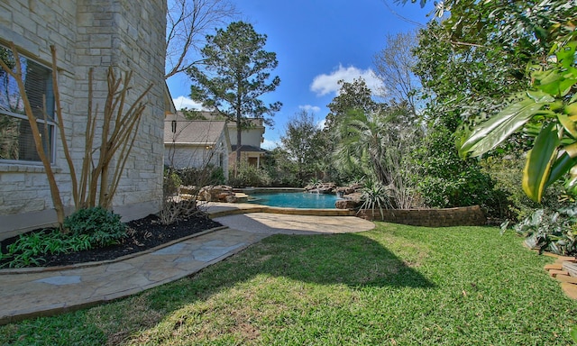 view of yard featuring an outdoor pool