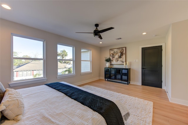 bedroom with visible vents, baseboards, ceiling fan, light wood-type flooring, and recessed lighting