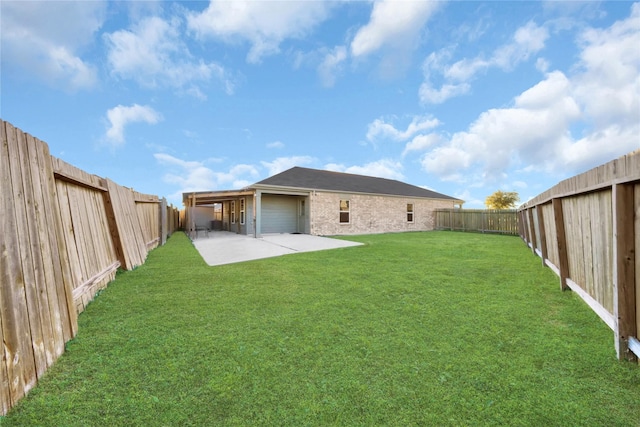 back of house featuring a patio, a yard, and a fenced backyard